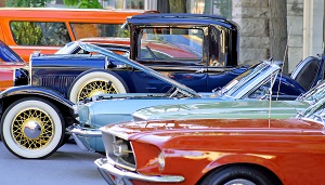 antique cars in a line